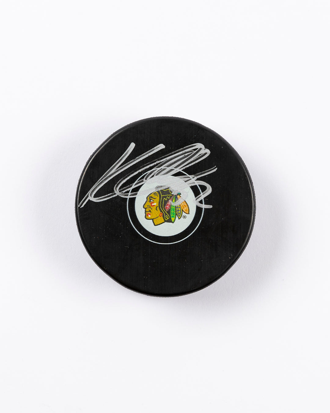 signed Chicago Blackhawks hockey puck signed by Kevin Lankinen - front lay flat