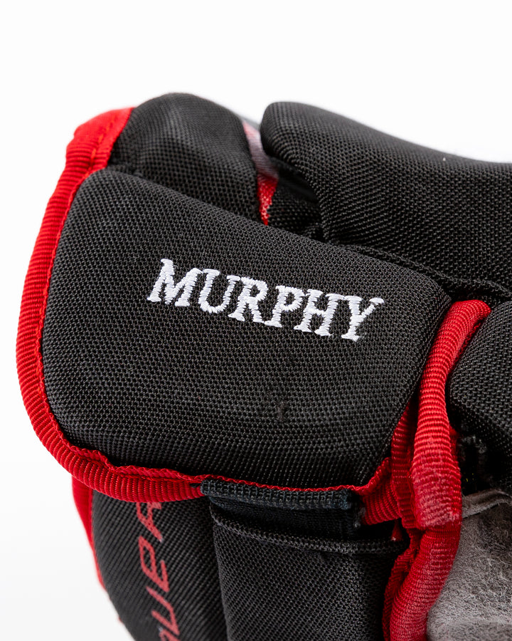 signed game-used Bauer hockey gloves from Chicago Blackhawks Connor Murphy - name detail lay flat