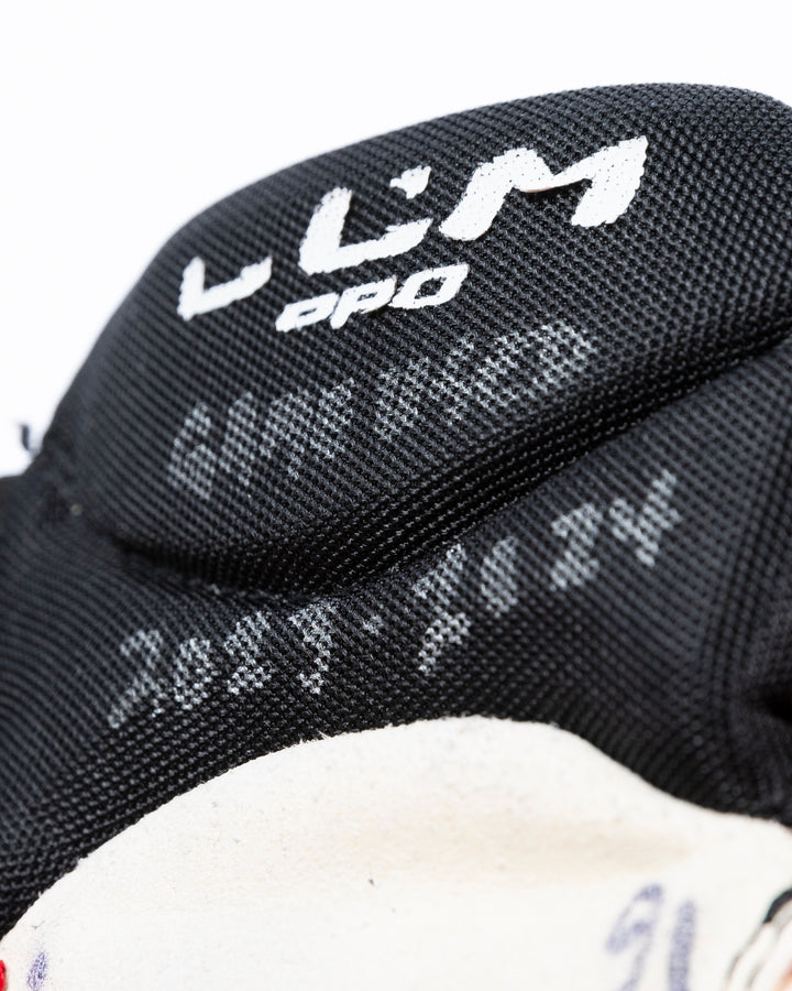 CCM game-used hockey gloves signed by Chicago Blackhawks Jason Dickinson - alt detail lay flat