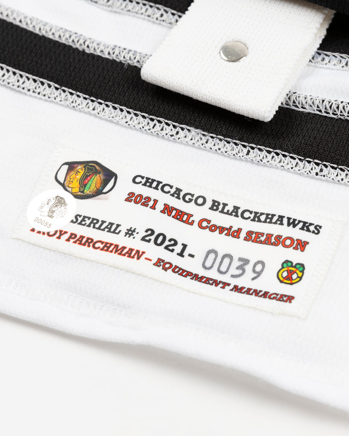 red team issued Chicago Blackhawks jersey with Mattias Janmark name and number - authentication detail lay flat