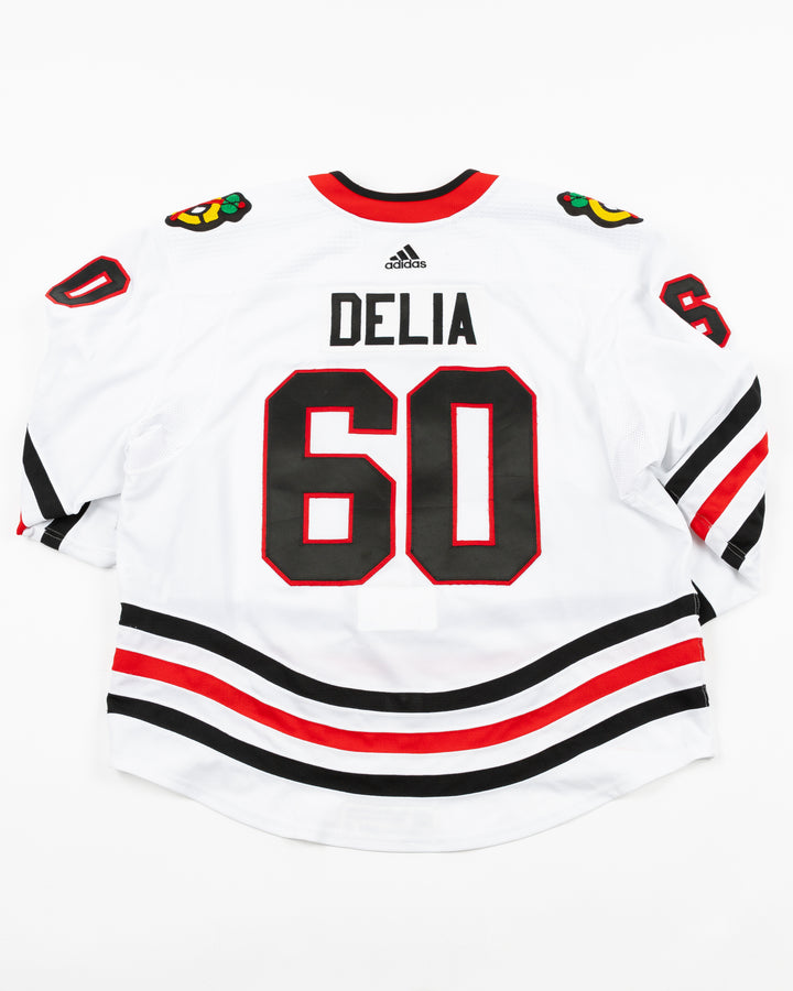 white team issued Chicago Blackhawks jersey with Collin Delia name and number - back lay flat