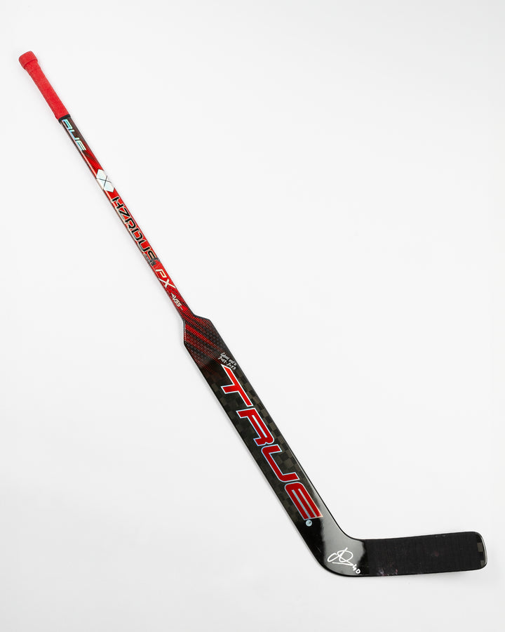 signed game-used goalie hockey stick from Chicago Blackhawks goalie Arvid Soderblom - front lay flat