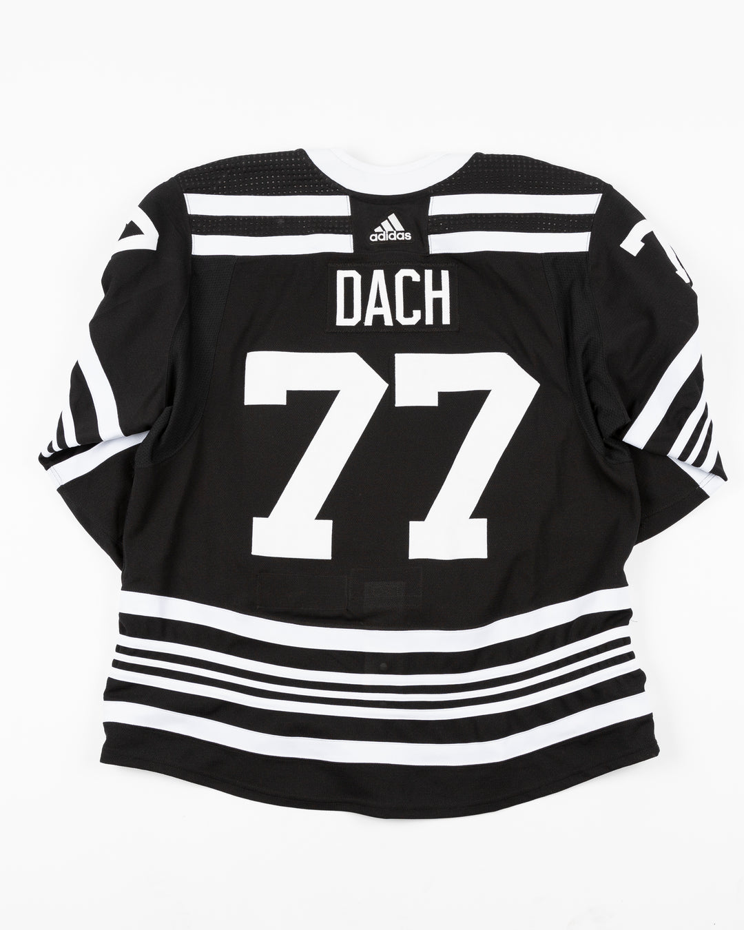 black alternate team-issued Chicago Blackhawks jersey of former player Kirby Dach - back lay flat