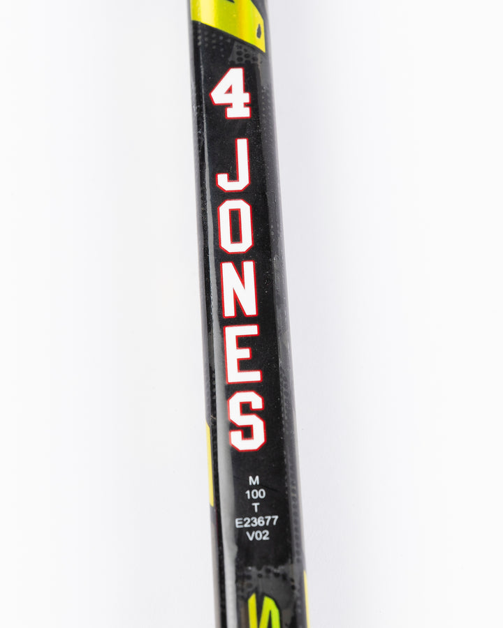 game-used hockey stick signed by Chicago Blackhawks player Seth Jones - name detail lay flat