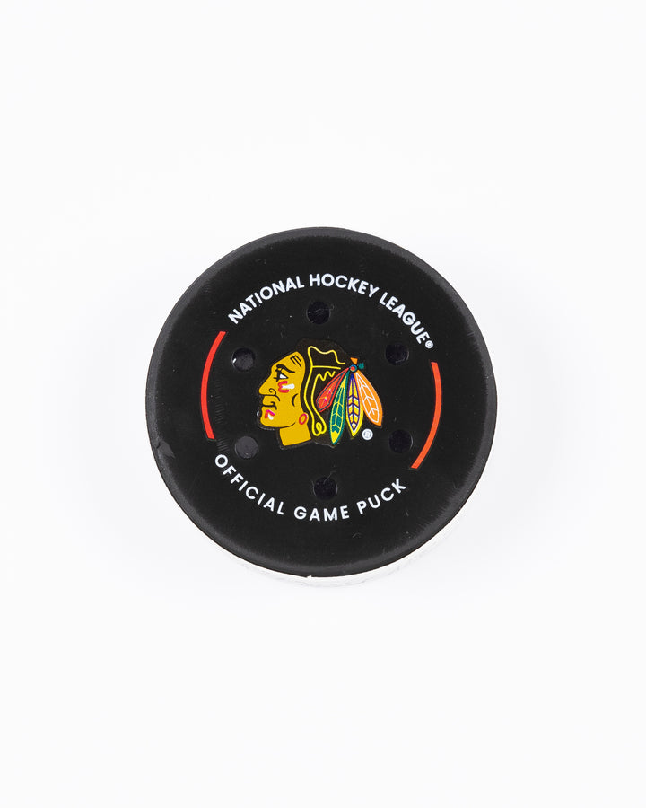 game used hockey puck from the Chicago Blackhawks game on October 22, 2024 - front lay flat