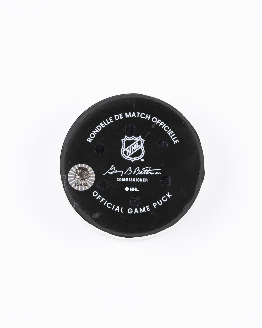 game used hockey puck from the Chicago Blackhawks game on October 22, 2024 - back lay flat