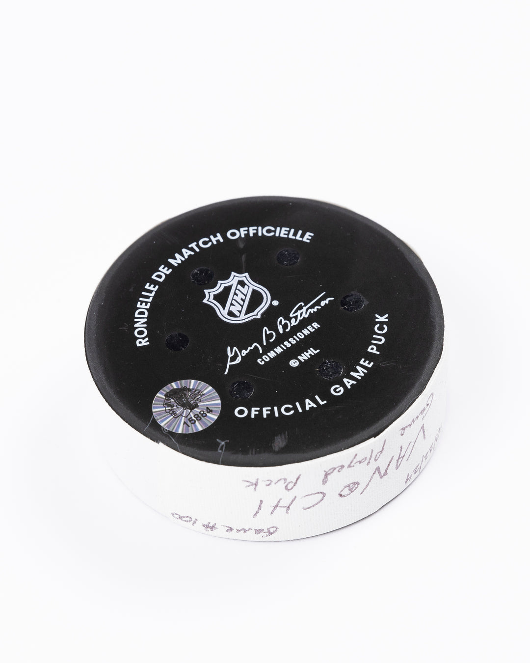 game used hockey puck from the Chicago Blackhawks game on October 22, 2024 - back angled lay flat