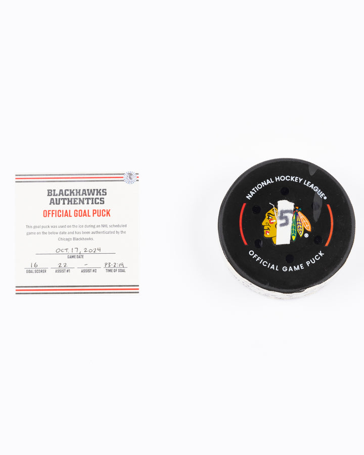 game-used hockey goal puck scored by Chicago Blackhawks player Jason Dickinson - front lay flat with certificate