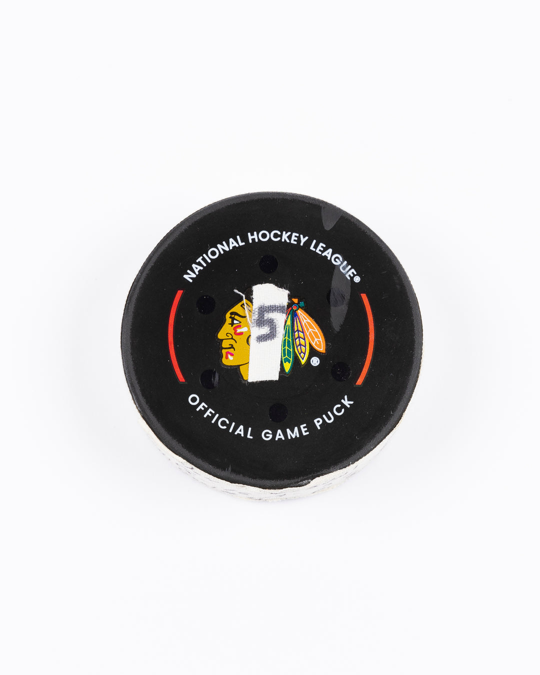 game-used hockey goal puck scored by Chicago Blackhawks player Jason Dickinson - front lay flat