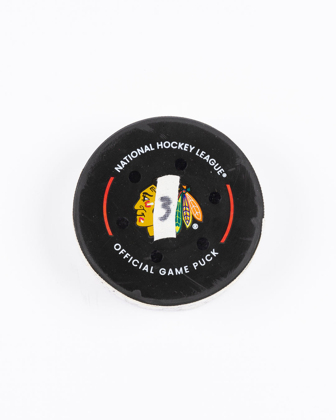 game-used hockey goal puck scored by Chicago Blackhawks player Craig Smith on October 19, 2024 - front lay flat