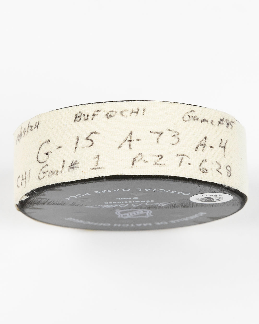 game-used hockey goal puck scored by Chicago Blackhawks player Craig Smith on October 19, 2024 - side lay flat