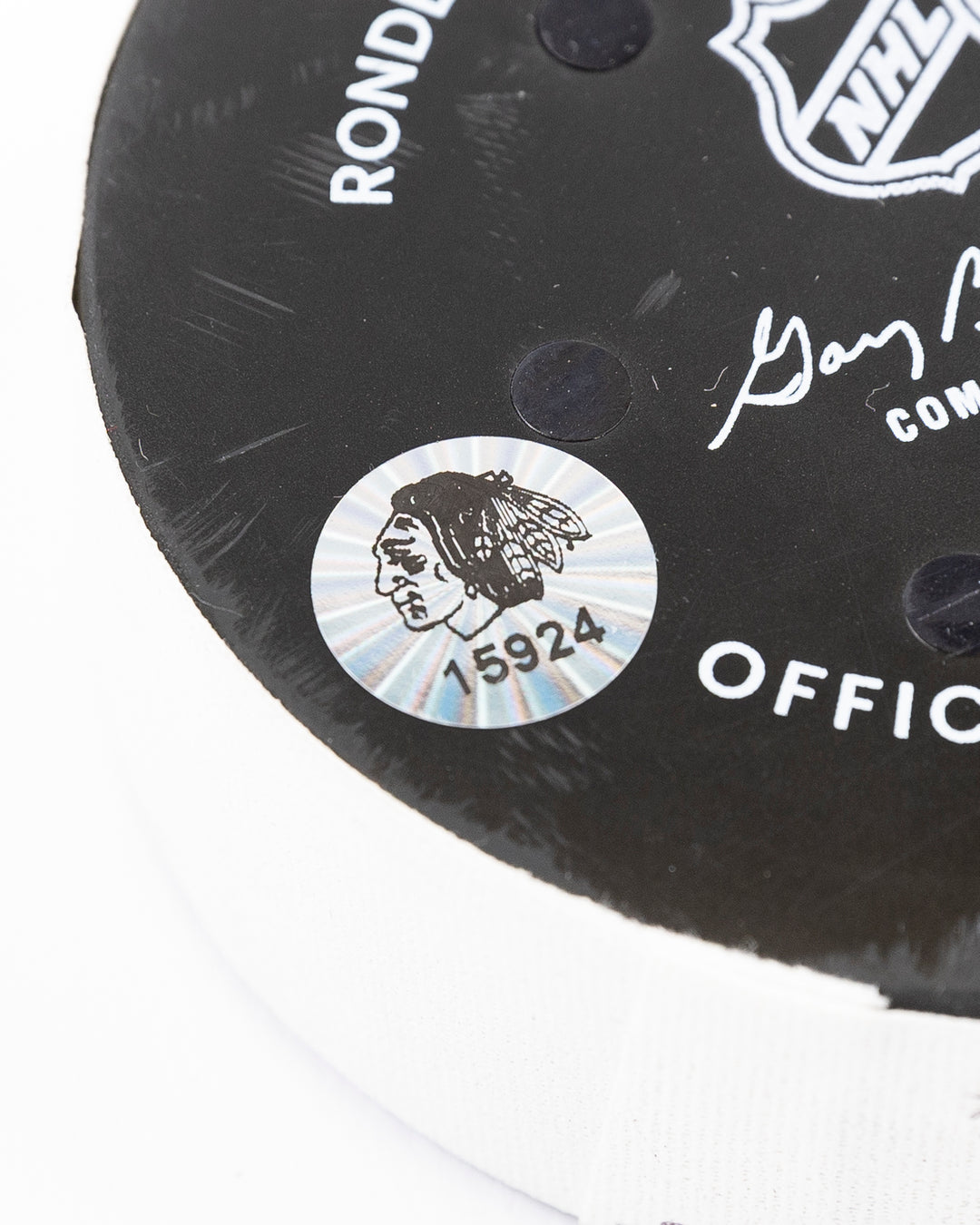 Chicago Blackhawks official game used puck against Anaheim Ducks in November 2024 - hologram sticker detail lay flat