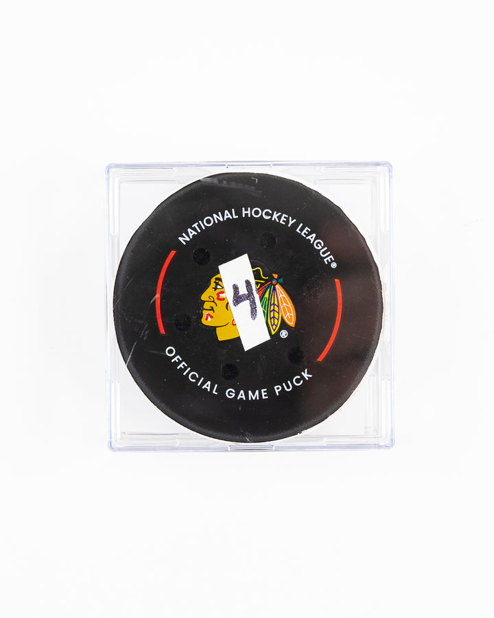 official Chicago Blackhawks hockey goal puck scored by Nick Foligno against the Florida Panthers in November 2024 - front lay flat of puck in case