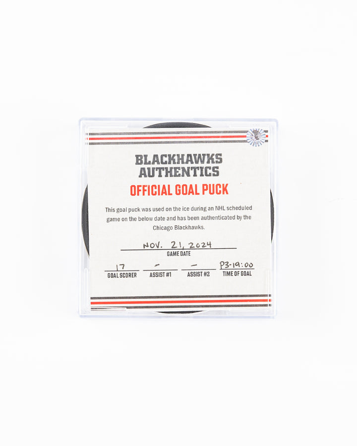 official Chicago Blackhawks hockey goal puck scored by Nick Foligno against the Florida Panthers in November 2024 - front lay flat of puck in case with certificate