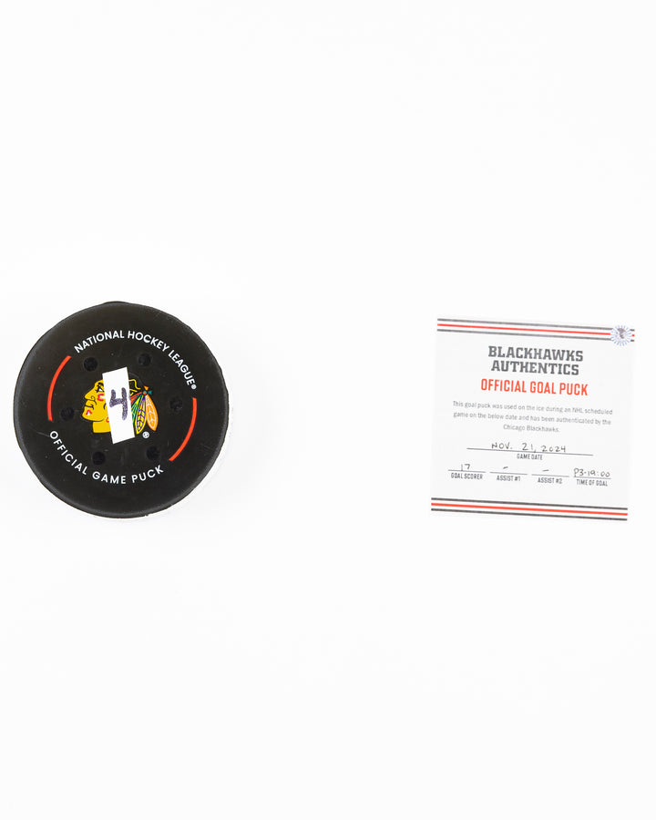 official Chicago Blackhawks hockey goal puck scored by Nick Foligno against the Florida Panthers in November 2024 - front lay flat of puck and certificate