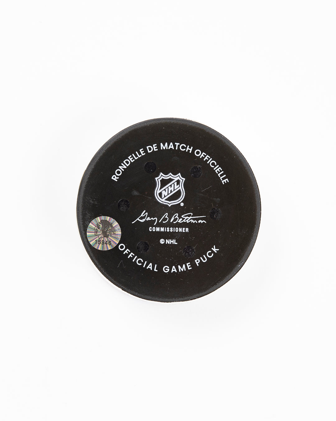 official Chicago Blackhawks hockey goal puck scored by Nick Foligno against the Florida Panthers in November 2024 - back lay flat