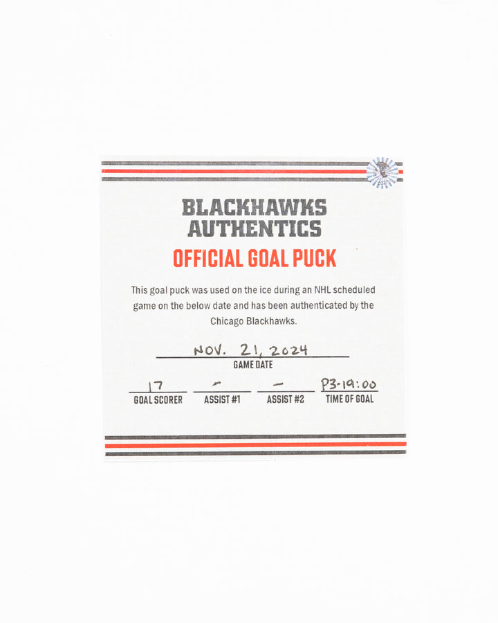 official Chicago Blackhawks hockey goal puck scored by Nick Foligno against the Florida Panthers in November 2024 - certificate front lay flat