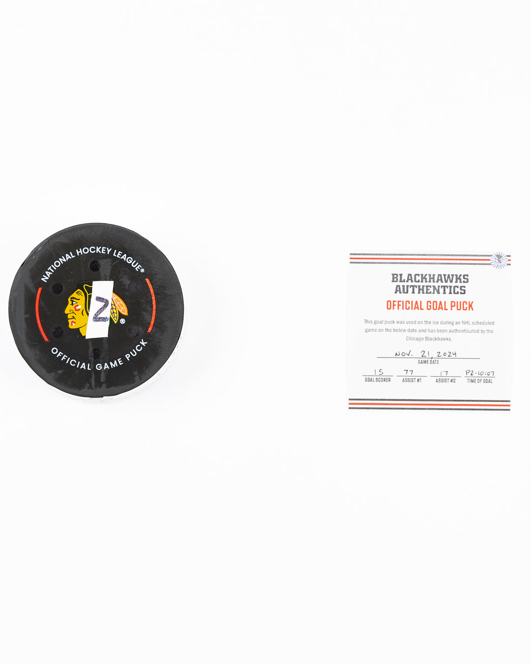 official Chicago Blackhawks hockey goal puck scored by Craig Smith against the Florida Panthers in November 2024 - front lay flat of puck and certificate