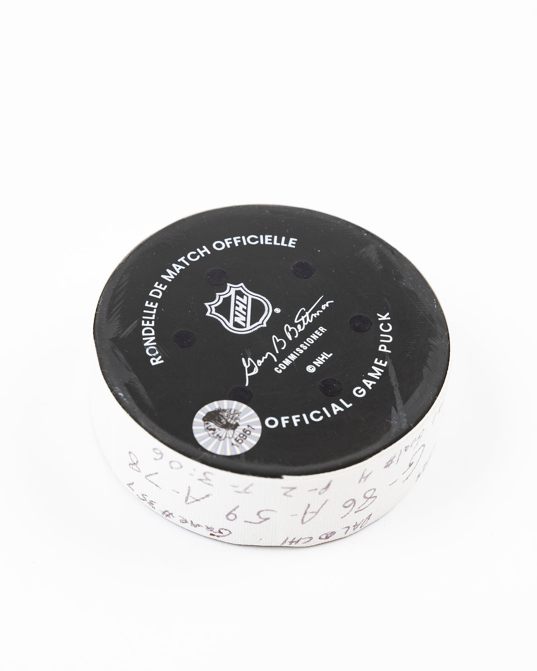 official Chicago Blackhawks hockey goal puck scored by Teuvo Teravainen against the Florida Panthers in November 2024 - back angled lay flat