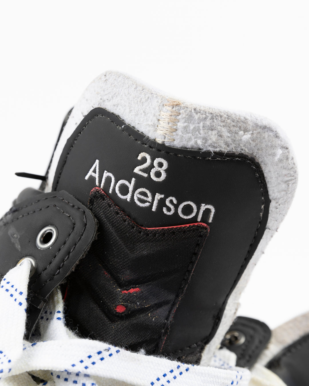 black CCM hockey skates worn by Chicago Blackhawks player Joey Anderson - name and number detail lay flat