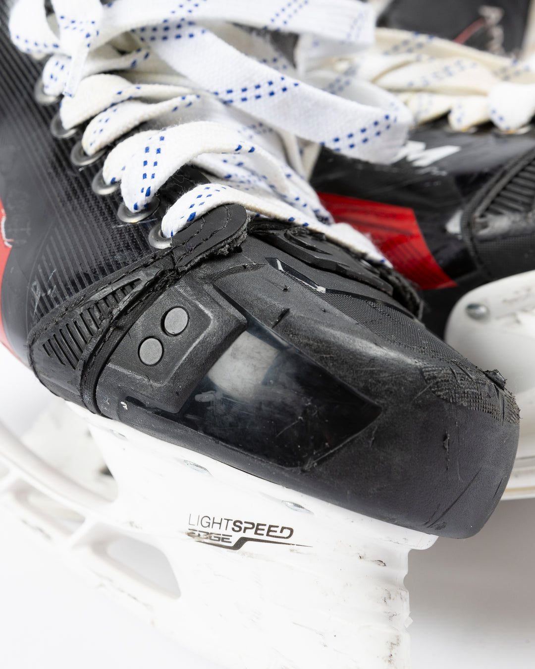 black CCM hockey skates worn by Chicago Blackhawks player Joey Anderson - front detail lay flat