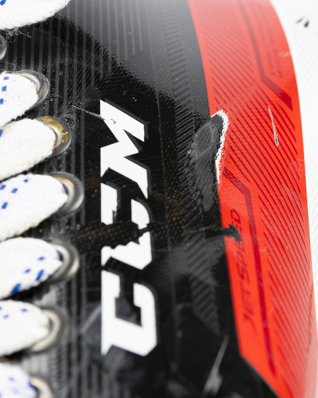 black CCM hockey skates worn by Chicago Blackhawks player Joey Anderson - logo detail lay flat