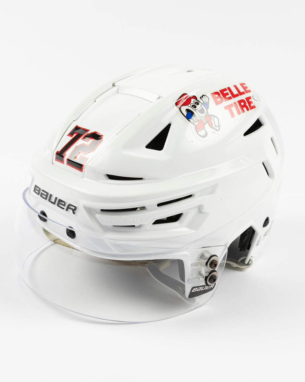 white Bauer hockey helmet used and worn by Chicago Blackhawks player Alex Vlasic - left angle lay flat