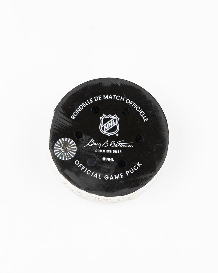 official Chicago Blackhawks hockey puck game used and scored by player Tyler Bertuzzi - back lay flat