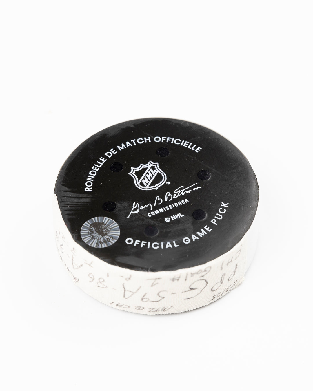 official Chicago Blackhawks hockey puck game used and scored by player Tyler Bertuzzi - back angle lay flat