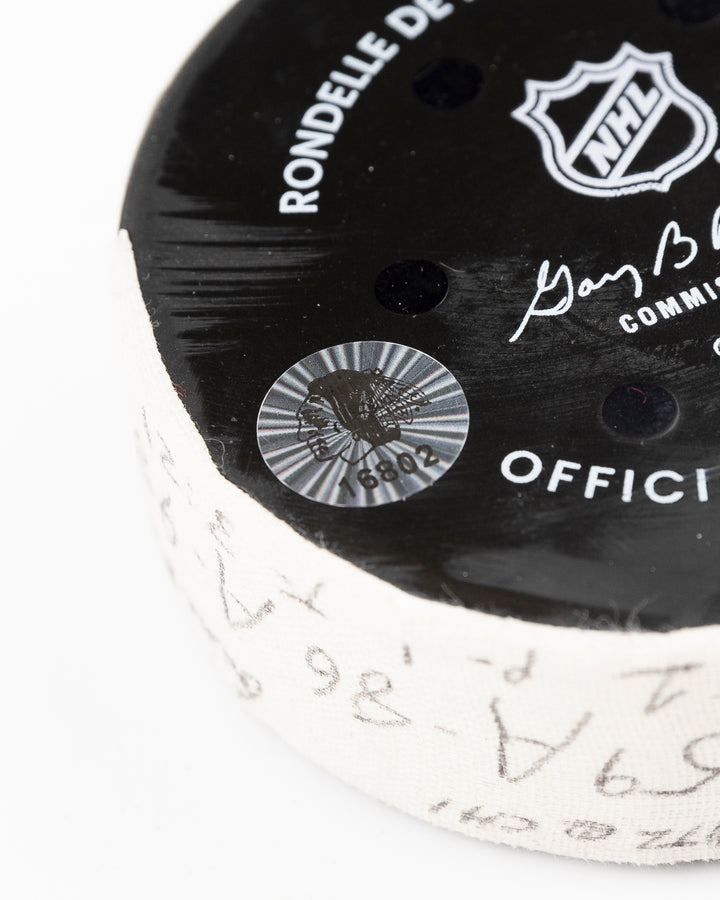 official Chicago Blackhawks hockey puck game used and scored by player Tyler Bertuzzi - hologram sticker detail lay flat