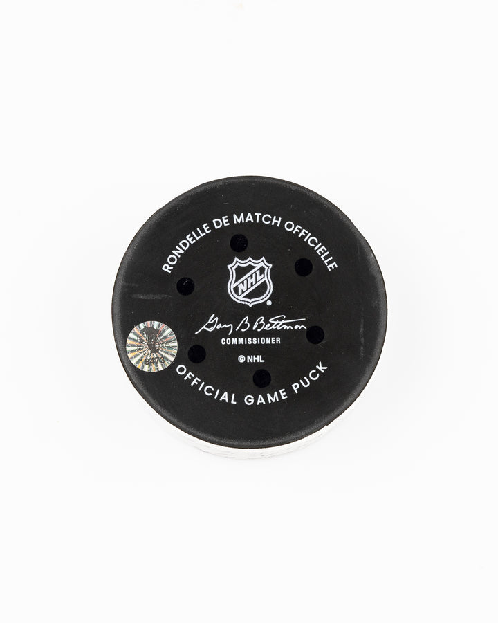 official Chicago Blackhawks game used goal puck scored by Tyler Bertuzzi against the Carolina Hurricanes on January 20, 2025 - back lay flat