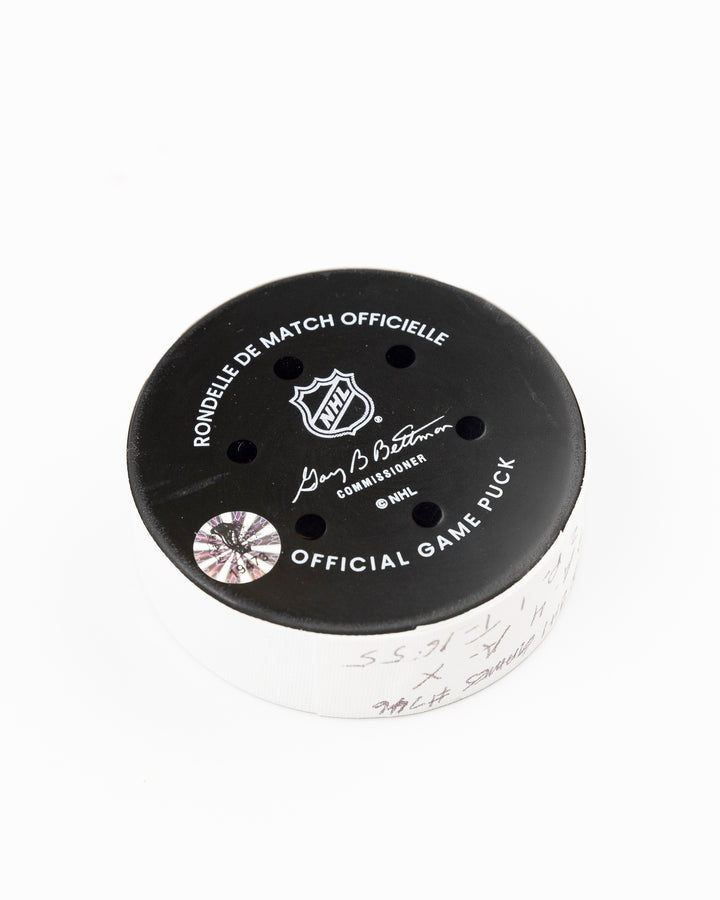 official Chicago Blackhawks game used goal puck scored by Tyler Bertuzzi against the Carolina Hurricanes on January 20, 2025 - back angle lay flat