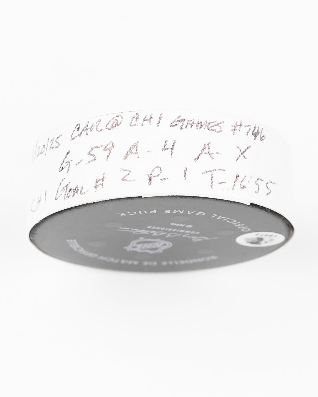official Chicago Blackhawks game used goal puck scored by Tyler Bertuzzi against the Carolina Hurricanes on January 20, 2025 - tape detail lay flat