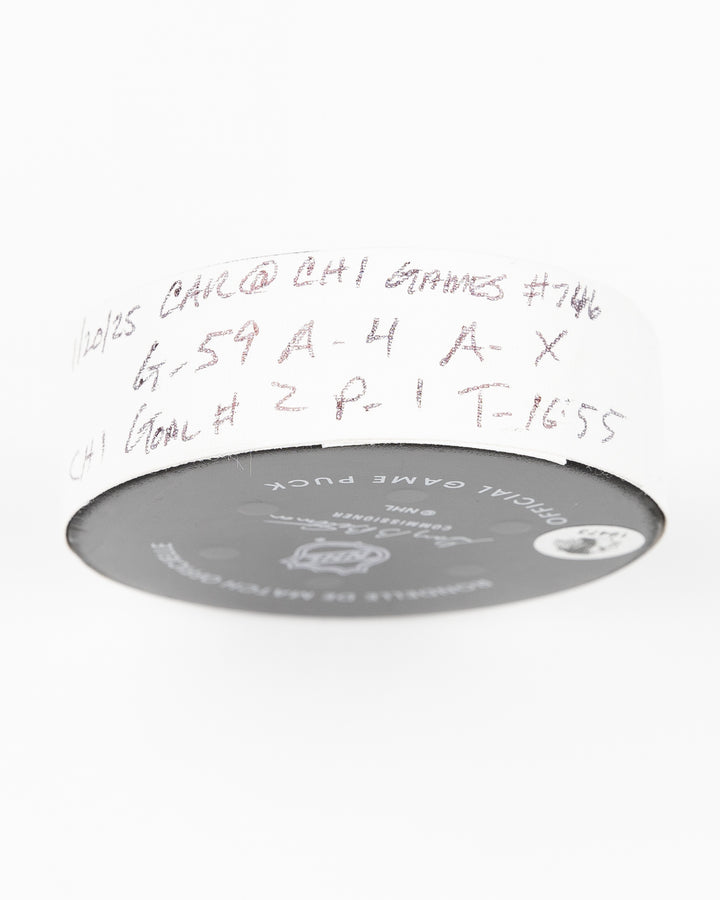 official Chicago Blackhawks game used goal puck scored by Tyler Bertuzzi against the Carolina Hurricanes on January 20, 2025 - tape detail lay flat