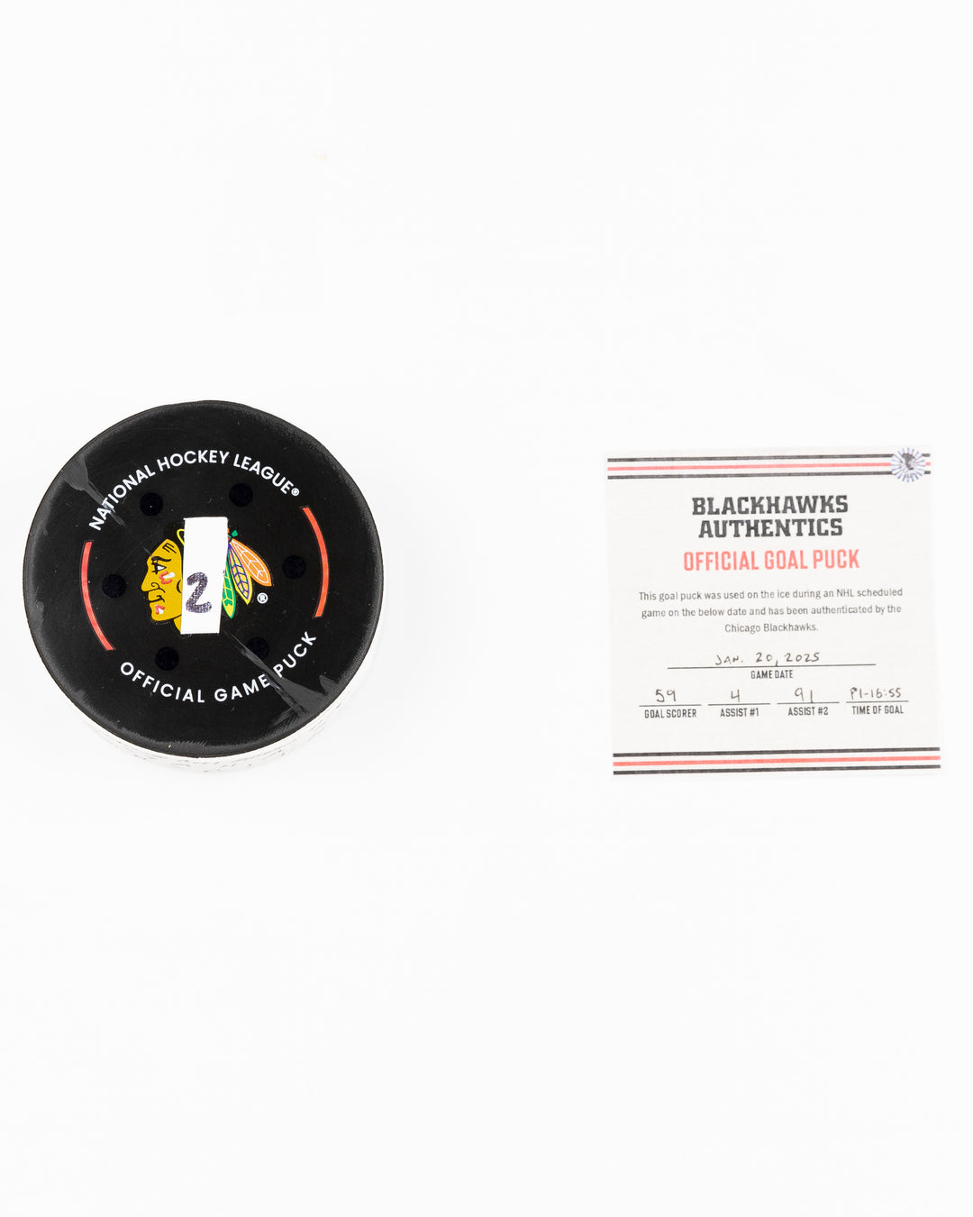 official Chicago Blackhawks game used goal puck scored by Tyler Bertuzzi against the Carolina Hurricanes on January 20, 2025 - front lay flat puck and certificate
