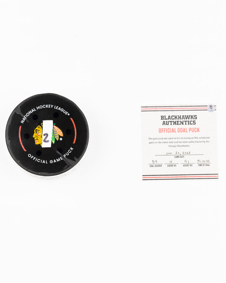 official Chicago Blackhawks game used goal puck scored by Tyler Bertuzzi against the Carolina Hurricanes on January 20, 2025 - front lay flat puck and certificate