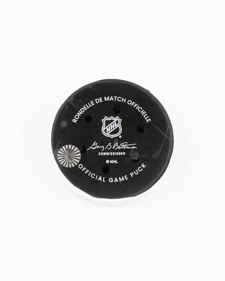 official Chicago Blackhawks game used goal puck scored by Tyler Bertuzzi against the Vegas Golden Knights on January 18, 2025 - back lay flat