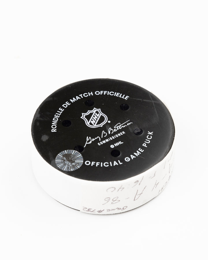 official Chicago Blackhawks game used goal puck scored by Tyler Bertuzzi against the Vegas Golden Knights on January 18, 2025 - back angle lay flat