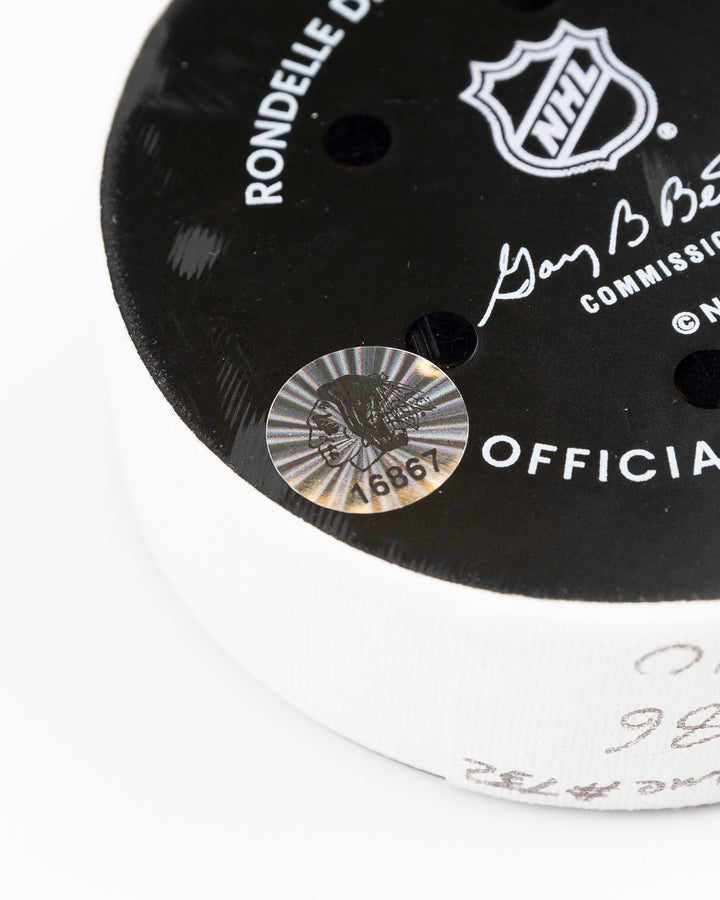 official Chicago Blackhawks game used goal puck scored by Tyler Bertuzzi against the Vegas Golden Knights on January 18, 2025 - hologram sticker detail lay flat