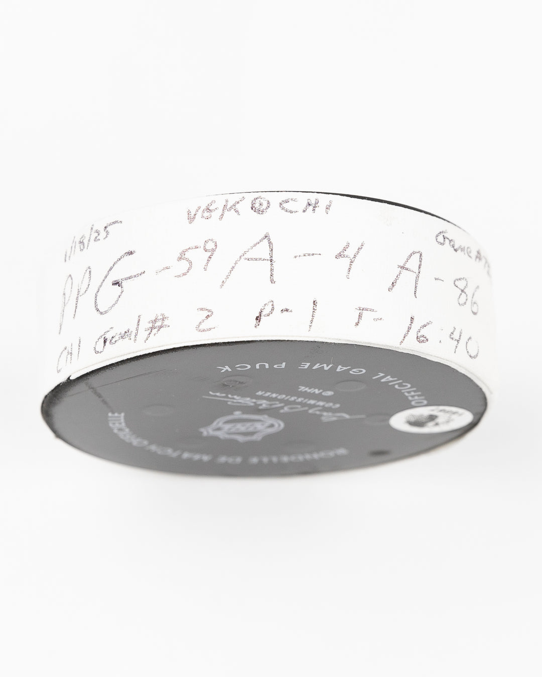 official Chicago Blackhawks game used goal puck scored by Tyler Bertuzzi against the Vegas Golden Knights on January 18, 2025 - tape detail lay flat