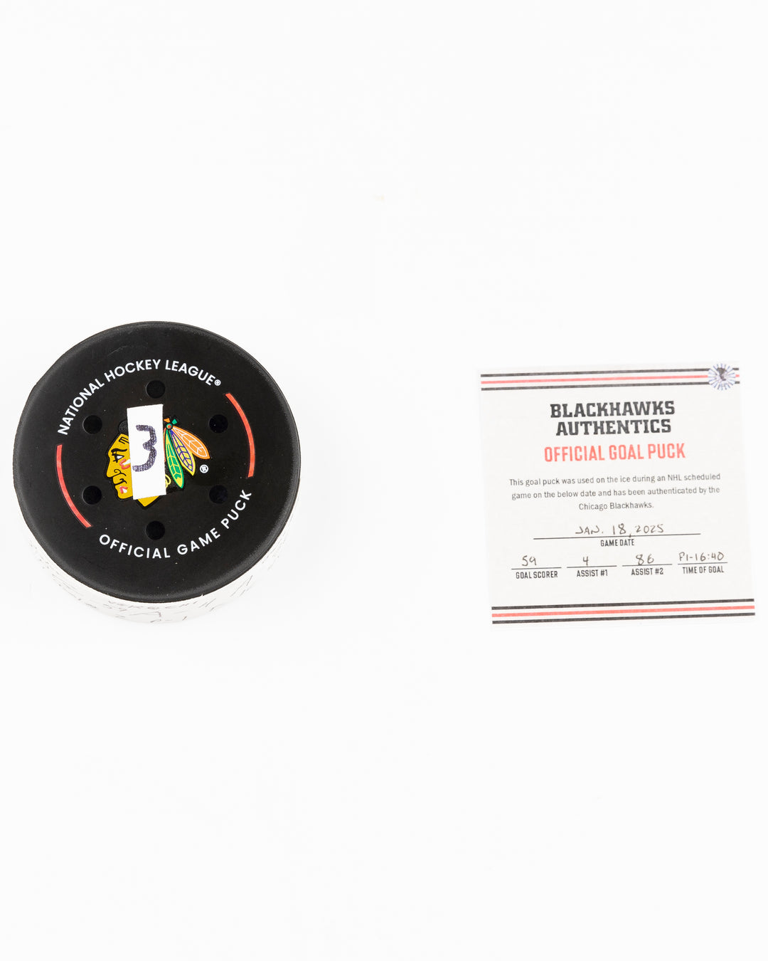 official Chicago Blackhawks game used goal puck scored by Tyler Bertuzzi against the Vegas Golden Knights on January 18, 2025 - front lay flat of puck and certificate