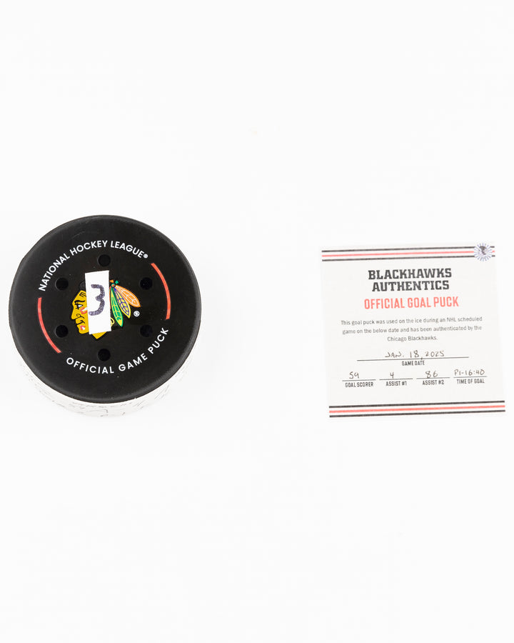 official Chicago Blackhawks game used goal puck scored by Tyler Bertuzzi against the Vegas Golden Knights on January 18, 2025 - front lay flat of puck and certificate