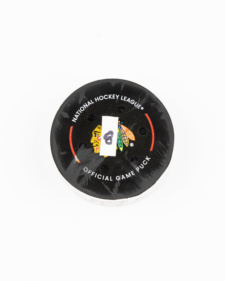 offcial Chicago Blackhawks game used goal hockey puck scored by Tyler Bertuzzi against Vegas Golden Knights on January 18, 2025 - front lay flat