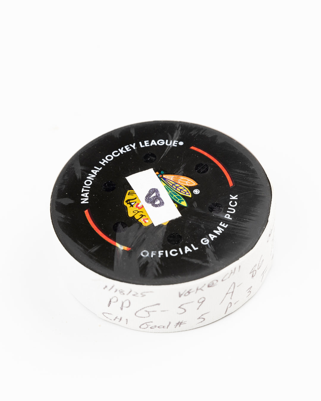 offcial Chicago Blackhawks game used goal hockey puck scored by Tyler Bertuzzi against Vegas Golden Knights on January 18, 2025 - front angle lay flat