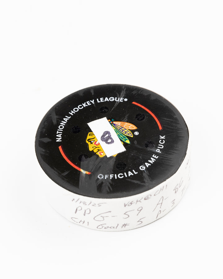 offcial Chicago Blackhawks game used goal hockey puck scored by Tyler Bertuzzi against Vegas Golden Knights on January 18, 2025 - front angle lay flat
