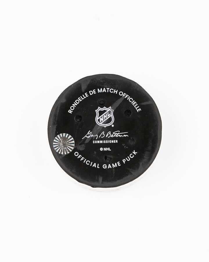 offcial Chicago Blackhawks game used goal hockey puck scored by Tyler Bertuzzi against Vegas Golden Knights on January 18, 2025 - back lay flat