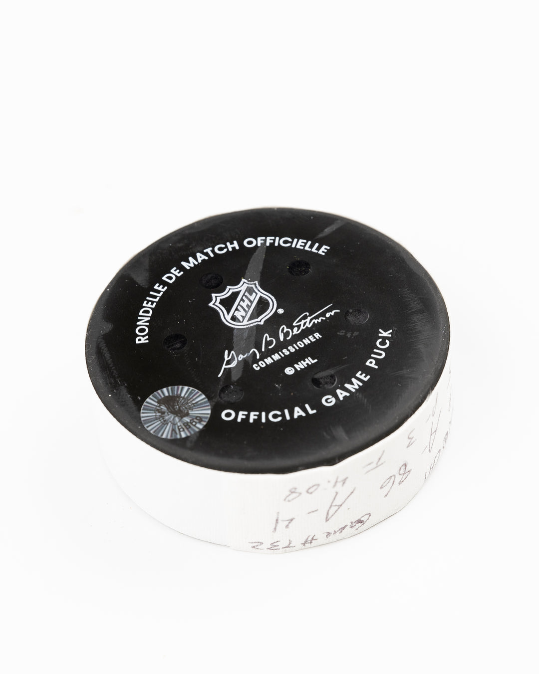 offcial Chicago Blackhawks game used goal hockey puck scored by Tyler Bertuzzi against Vegas Golden Knights on January 18, 2025 - back angle lay flat