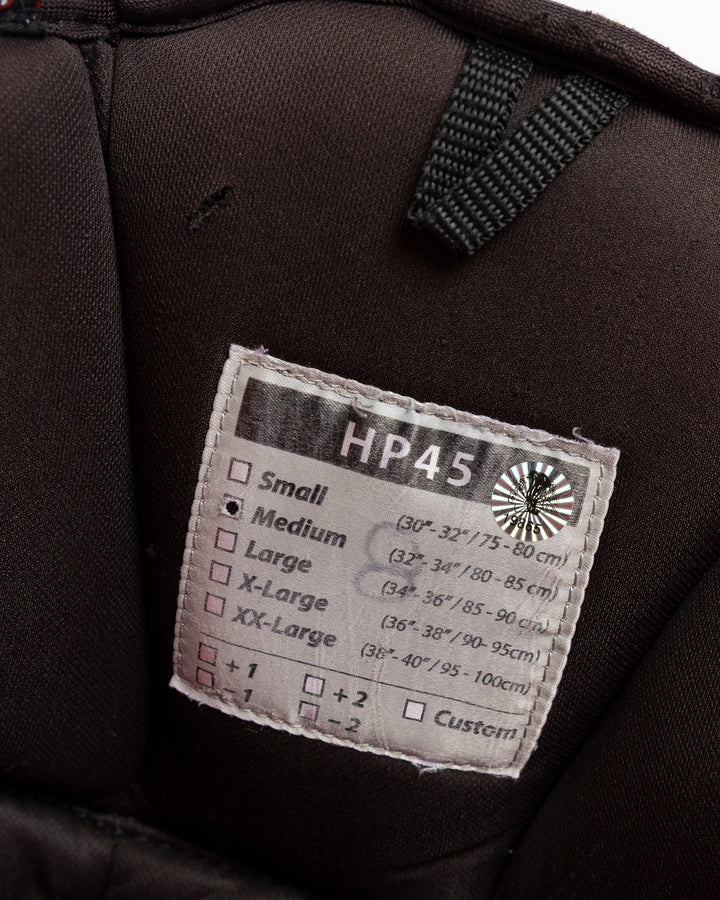 black CCM hockey pants used by Chicago Blackhawks player Ryan Donato - size tag detail lay flat