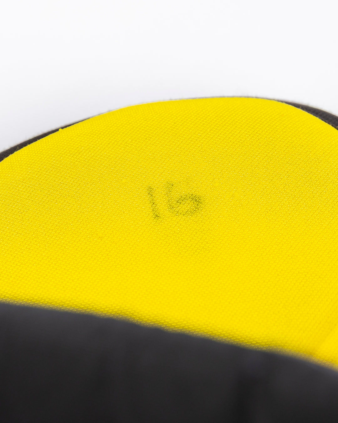 black CCM hockey pants used by Chicago Blackhawks player Jason Dickinson - number detail lay flat