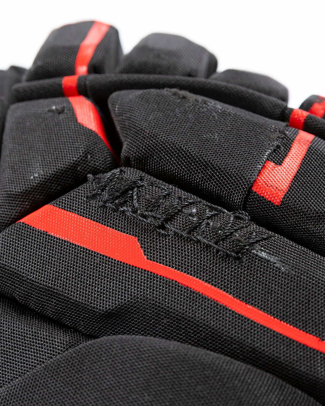 black Bauer hockey gloves used by Chicago Blackhawks player Pat Maroon - stitch detail lay flat